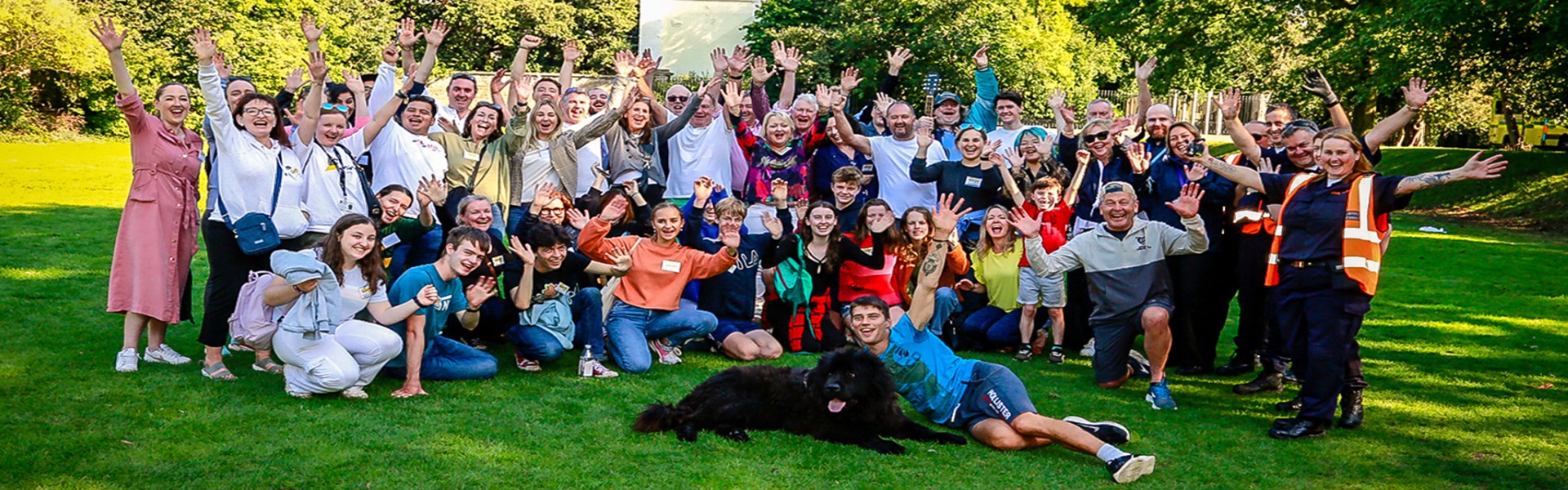 UCD in the Community Hopefest group photo with people and a dog